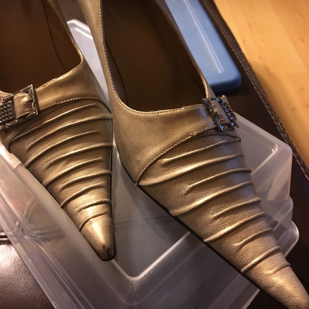 Gold tone pointy high heel with faux buckle
